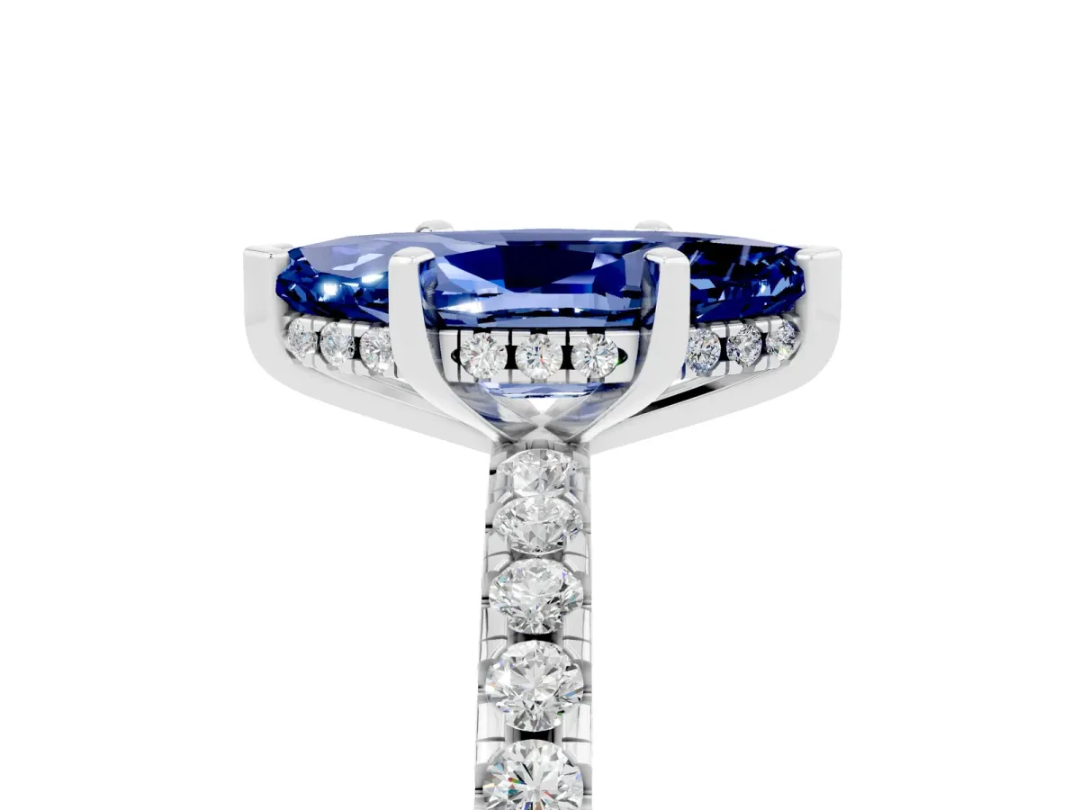Marquise Cut Blue Sapphire Solitaire Ring with Round Pavé Band and Four-Prong Setting Silver