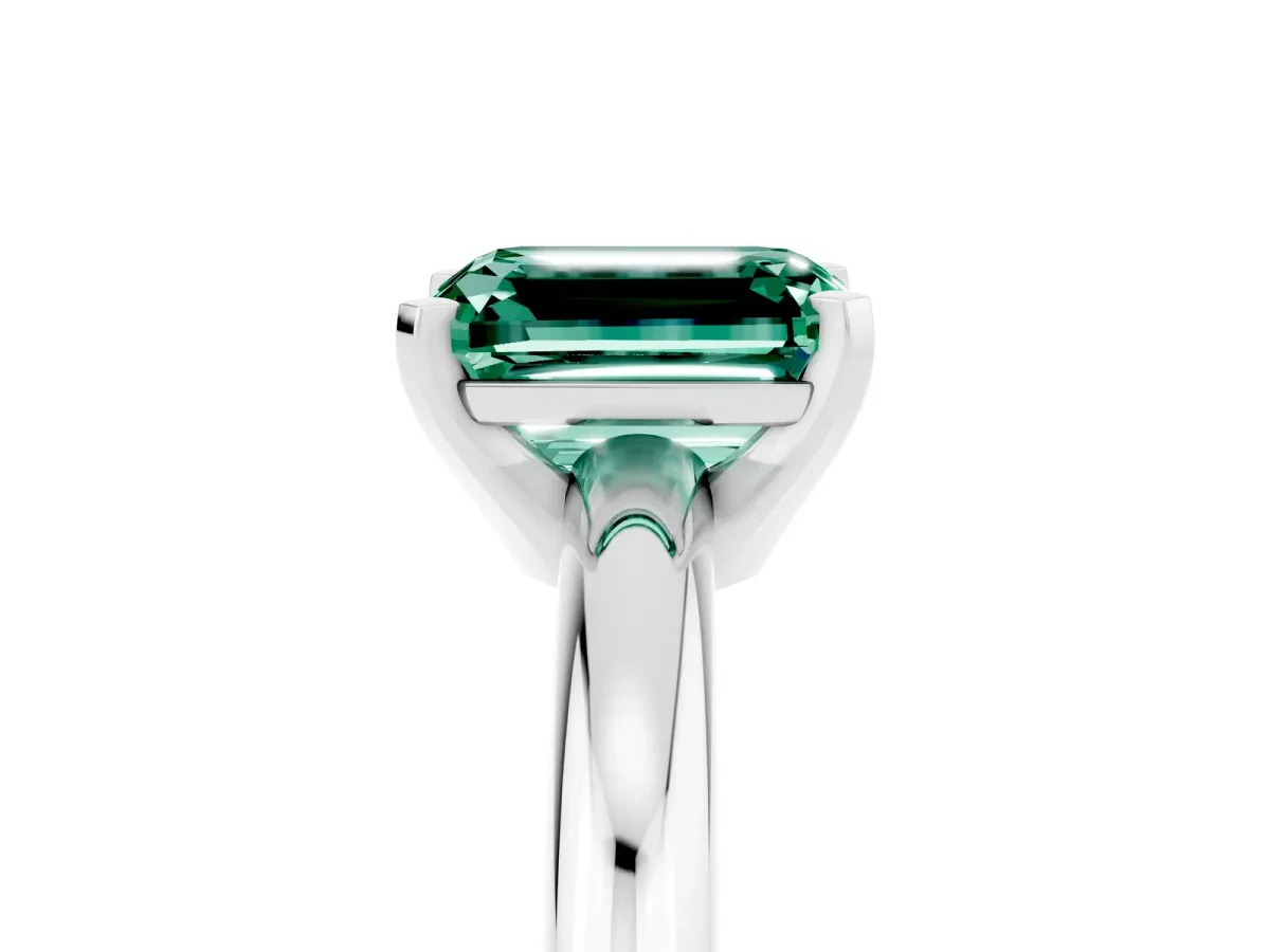 Emerald Cut Green Sapphire Solitaire Engagement Ring with Round Band and Four-Prong Setting Silver