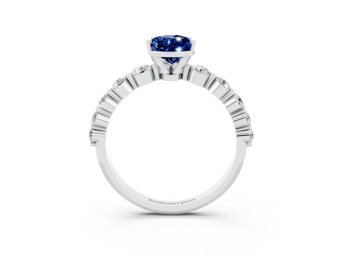 Pear Cut Solitaire Blue Sapphire Ring with Pave Band and Four-Prong Setting Platinum
