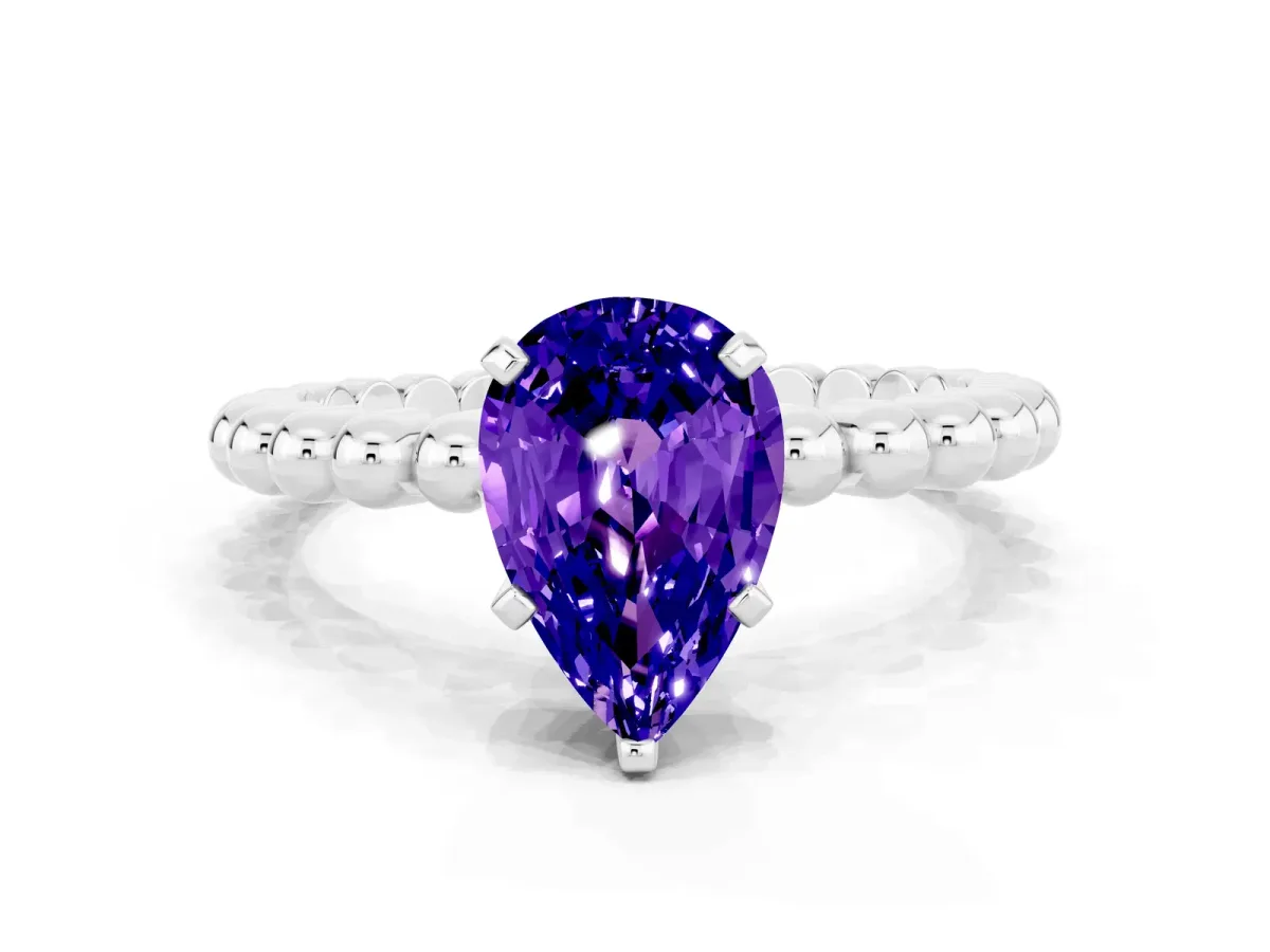 Pear Cut Tanzanite Solitaire Ring with Beaded Band and Prong Setting Platinum