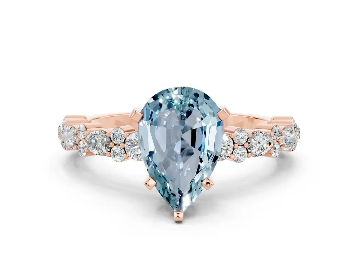 Pear Cut Aquamarine Side Stone Solitaire Ring with Round and Four-Prong Setting Rose gold