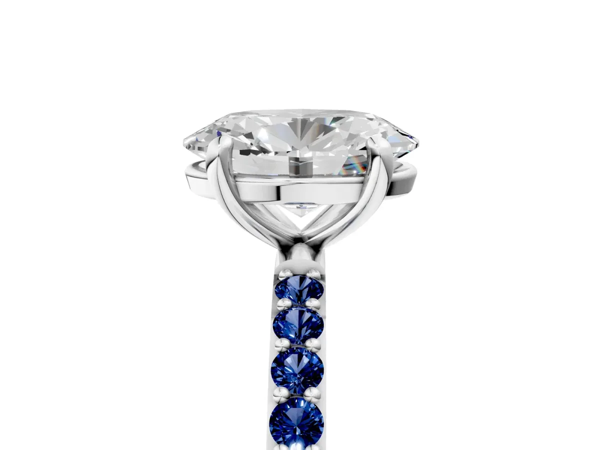 Oval Cut Diamond Solitaire Ring with Round Blue Sapphire Pavé Band and Prong Setting Silver