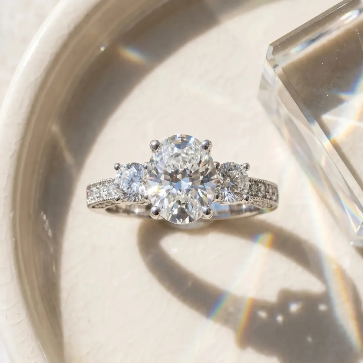 Asscher Cut Three-Stone Diamond Ring with Pavé Band and Four-Prong Setting Platinum