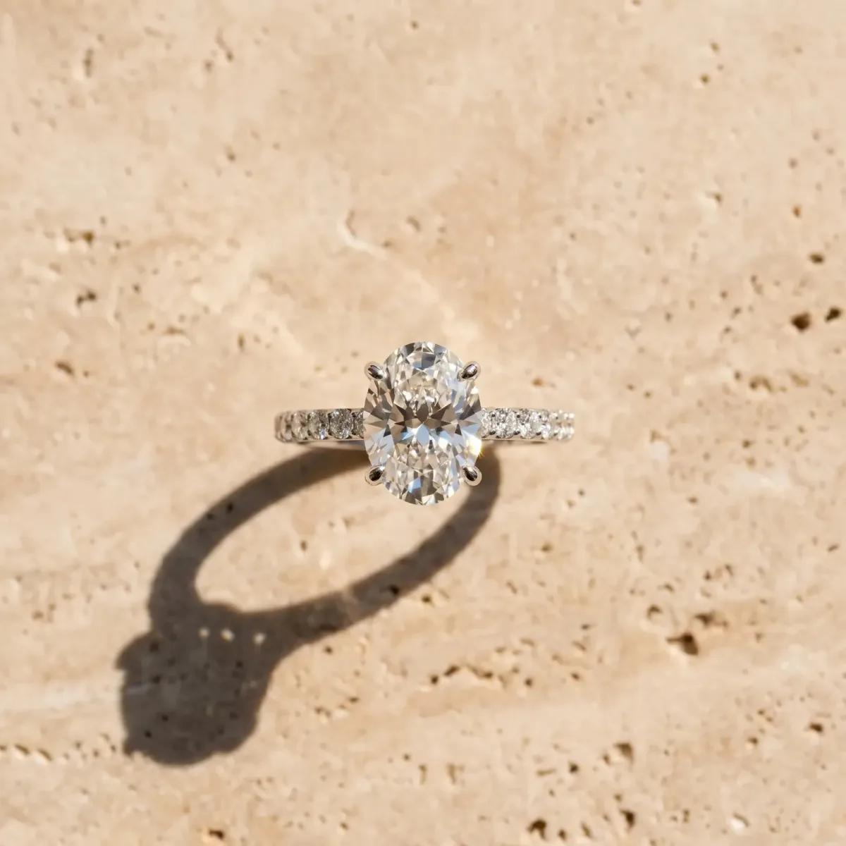 Oval Cut Diamond Solitaire Ring with Round Pavé Band and Prong Setting White gold