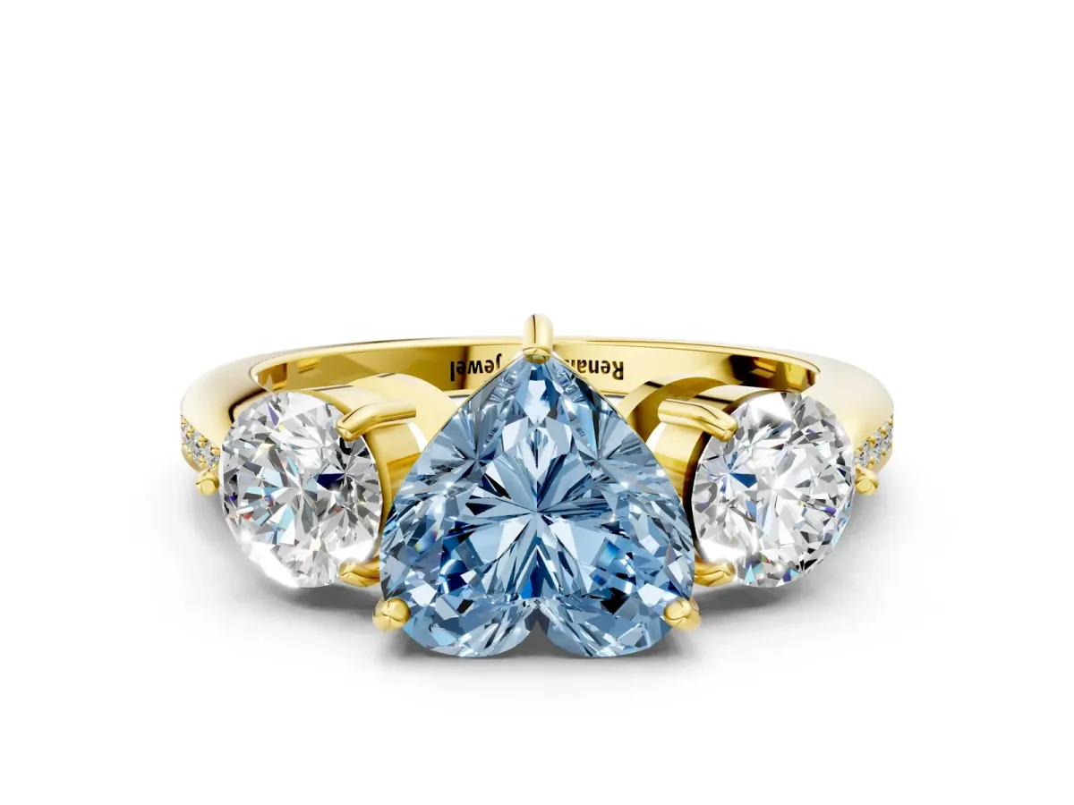 Fancy Blue Three-Stone Heart Cut Diamond Channel Set Engagement Ring with Prong Setting Yellow gold