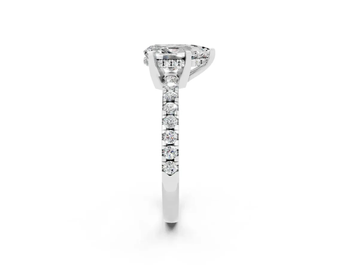 Pear Cut Moissanite Solitaire Ring with Round Pavé Band and Four-Prong Setting Silver