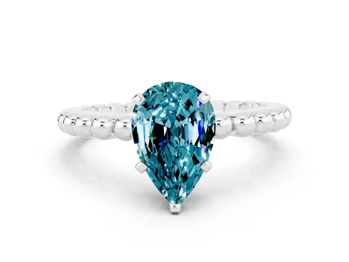 Pear Cut Blue Topaz Solitaire Ring with Beaded Band and Prong Setting Silver