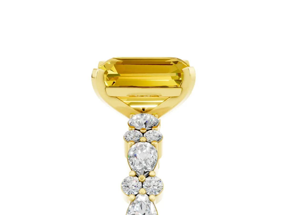 Emerald Cut Yellow Sapphire Side Stone Solitaire Ring with Round and Four-Prong Setting Yellow gold