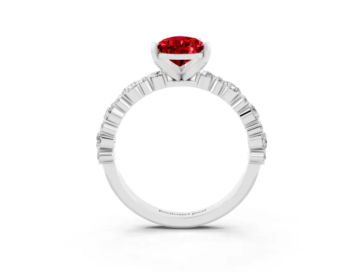 Pear Cut Ruby Side Stone Solitaire Ring with Round and Four-Prong Setting White gold