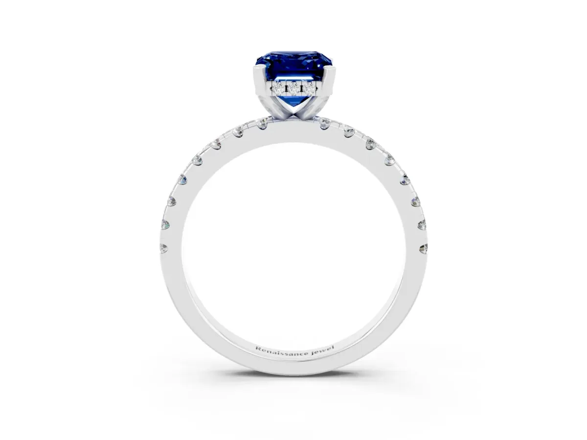 Emerald Cut Blue Sapphire Solitaire Ring with Round Pavé Band and Four-Prong Setting Silver