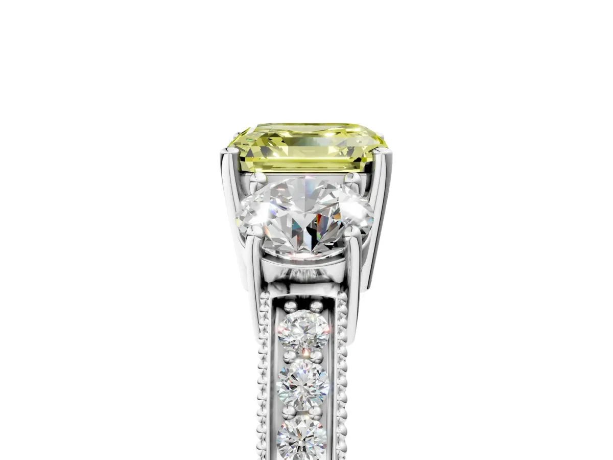 Fancy Yellow Asscher Cut Three-Stone Diamond Ring with Pavé Band and Four-Prong Setting Platinum