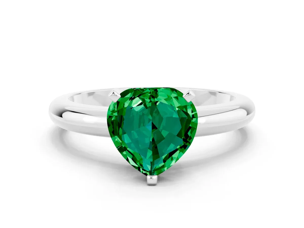 Heart Cut Emerald Solitaire Engagement Ring with Round Band and Four-Prong Setting Silver