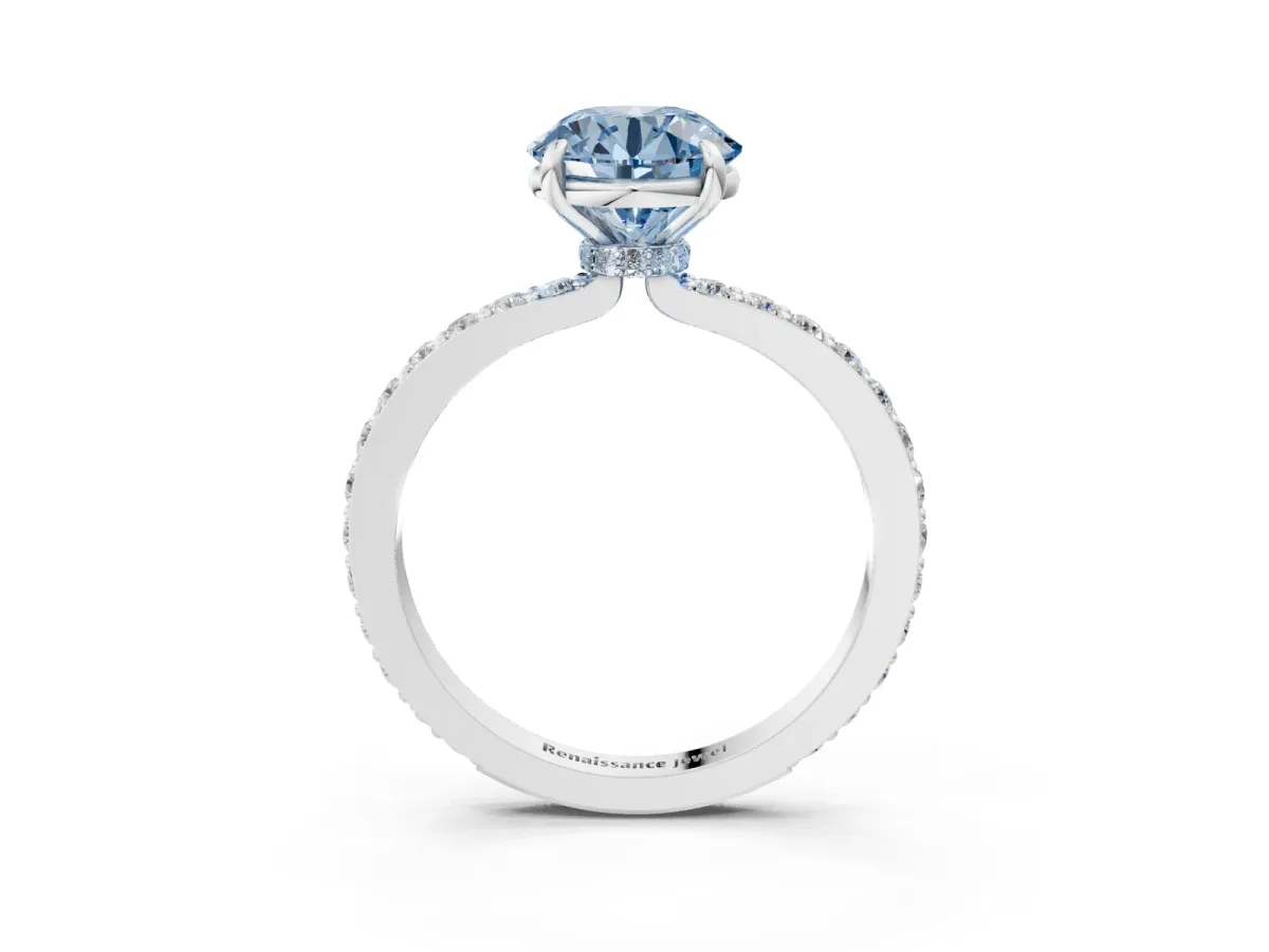 Fancy Blue Round Cut Diamond Solitaire Engagement Ring with Pavé Band and Four-Prong Setting Silver