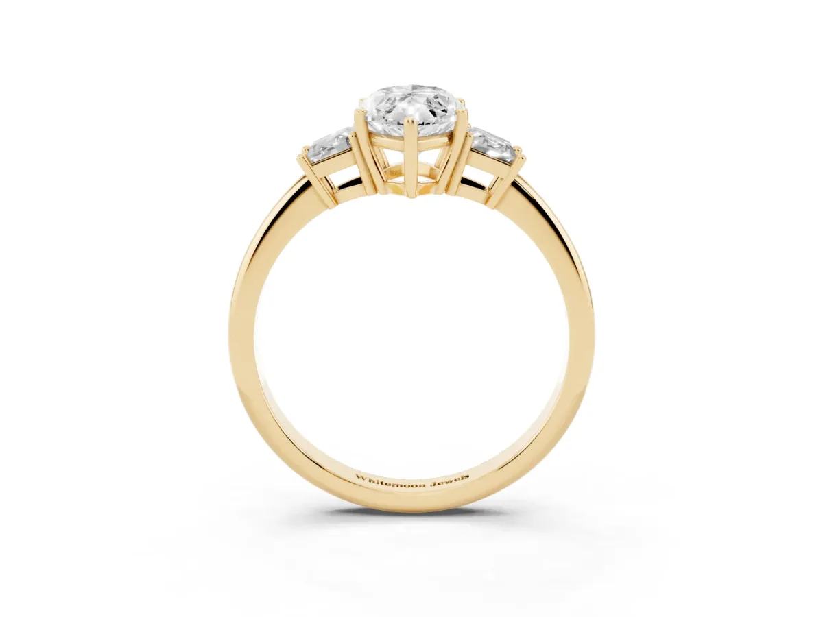 Marquise Cut Diamond Three-Stone Ring with Trapezoid Side Stones and Prong Setting Yellow gold