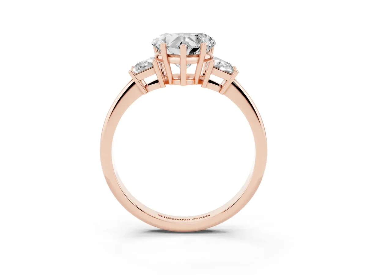 Heart Cut Diamond Three-Stone Ring with Trapezoid Side Stones and Prong Setting Rose gold