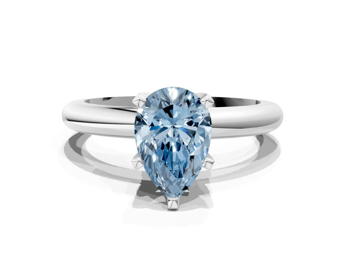 Fancy Blue Pear Cut Diamond Solitaire Engagement Ring with Round Band and Four-Prong Setting Silver