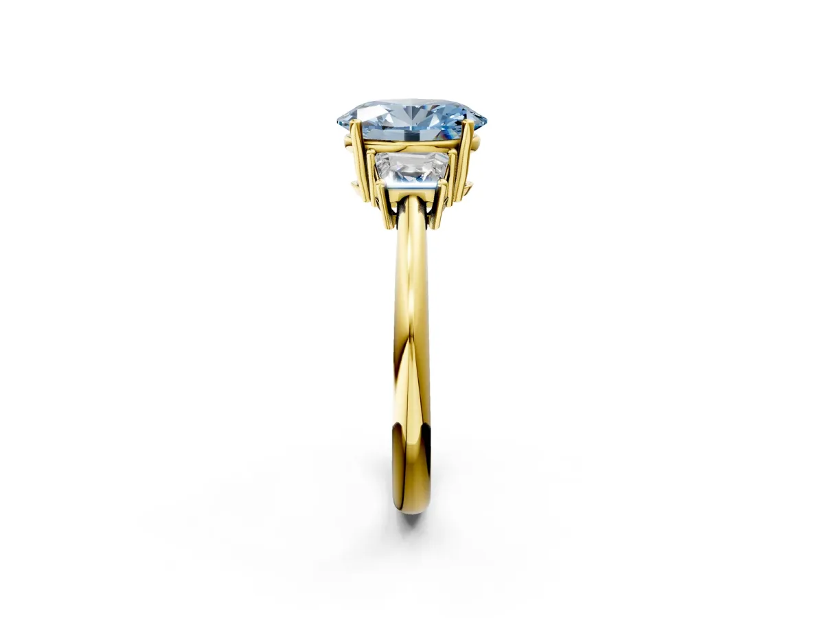 Fancy Blue Oval Cut Diamond Three-Stone Ring with Trapezoid Side Stones and Prong Setting Yellow gold