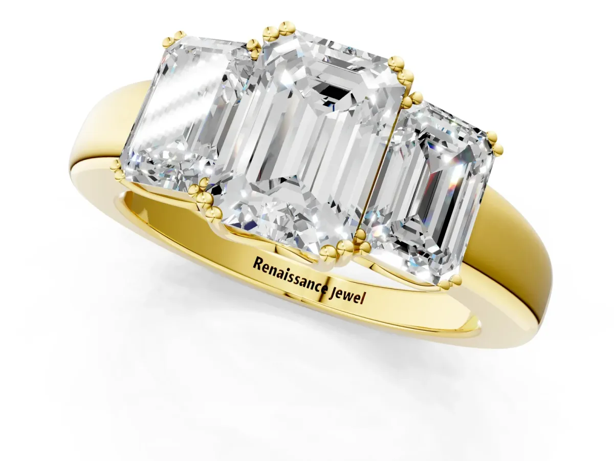 Three-Stone Emerald Cut Cut Diamond Ring with Channel Set Band and Four-Prong Setting Yellow gold