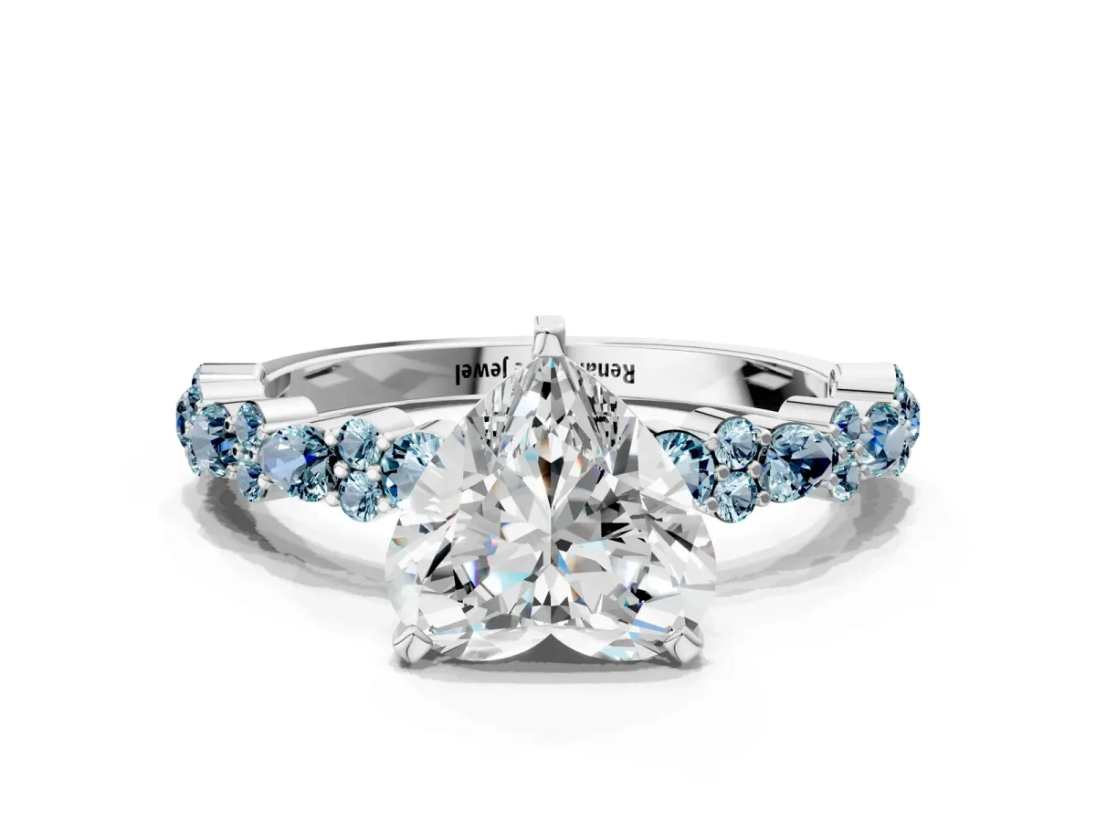Heart Cut Diamond Side Stone Solitaire Ring with Round Aquamarine and Four-Prong Setting Silver