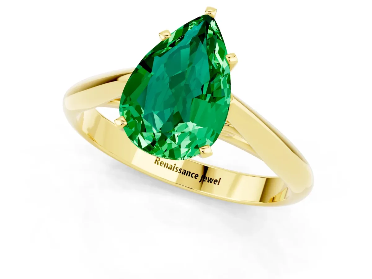 Pear Cut Emerald Solitaire Engagement Ring with Cathedral Setting and Four-Prong Mount Yellow gold
