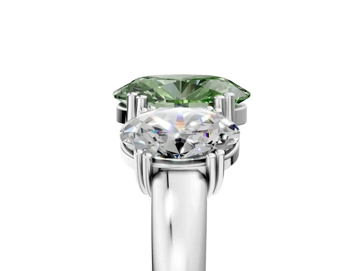 Fancy Green Three-Stone Oval Cut Cut Diamond Ring with Channel Set Band and Four-Prong Setting Platinum