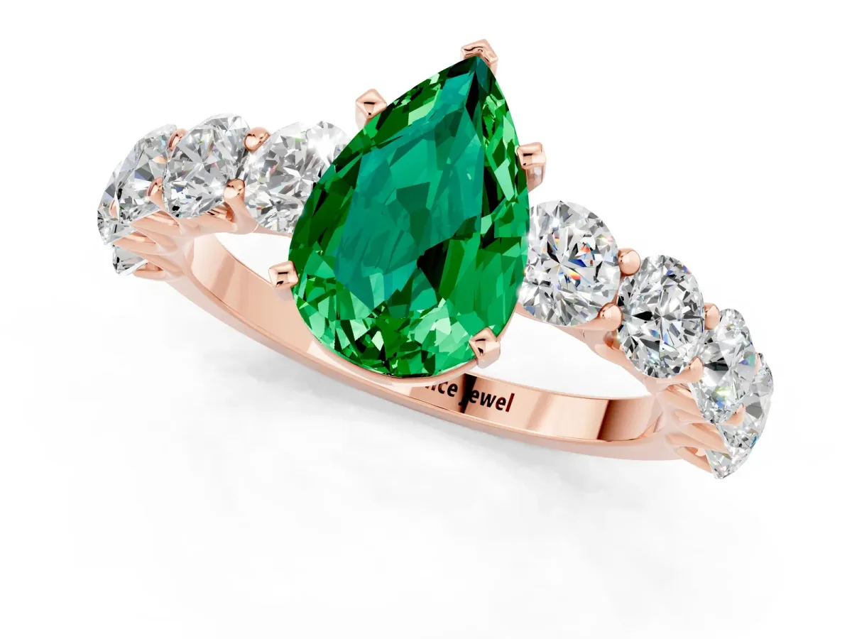Pear Cut Emerald Prong Setting with Side Stones on a Pave Band Rose gold