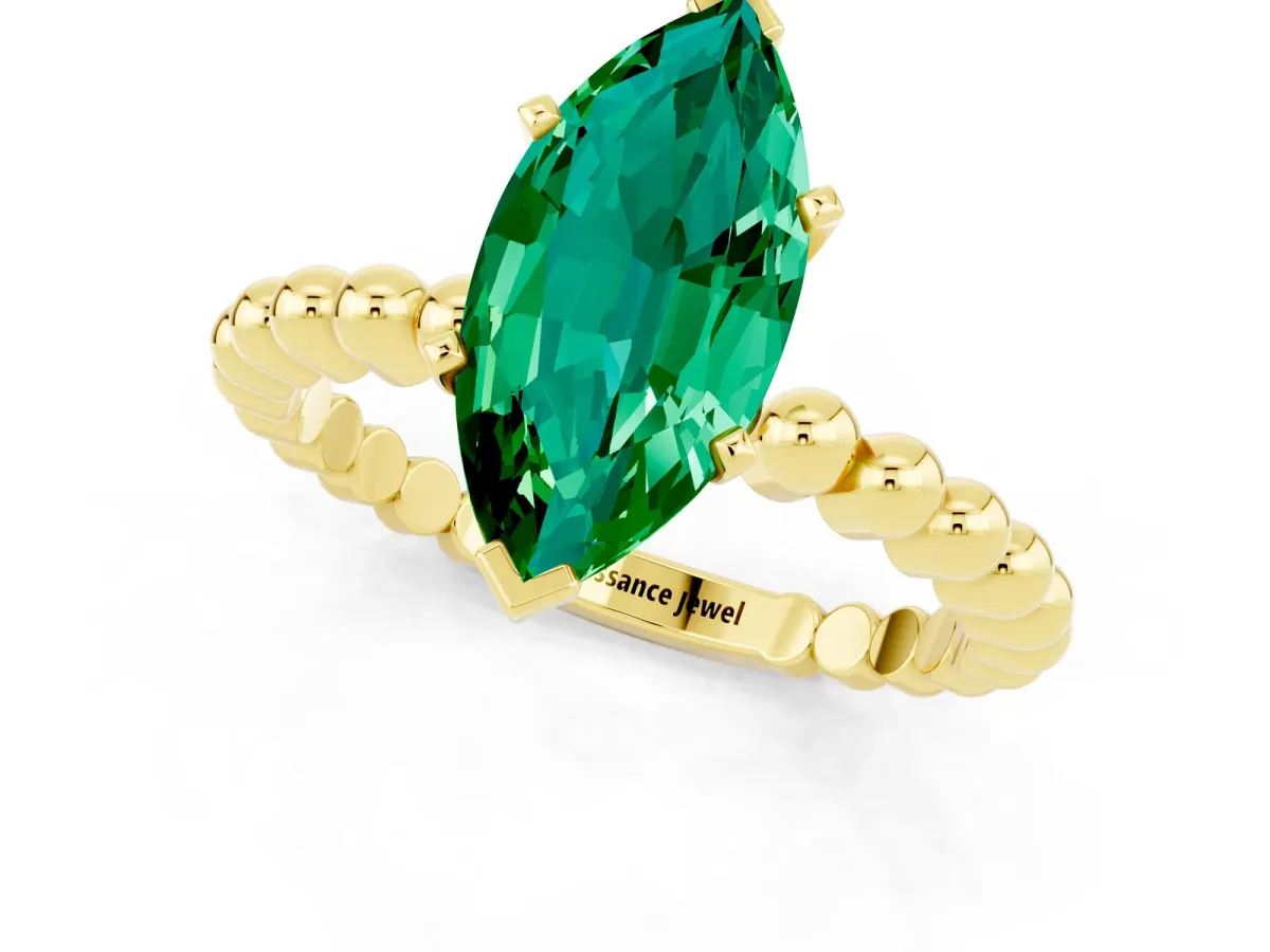 Marquise Cut Emerald Solitaire Ring with Beaded Band and Prong Setting Yellow gold