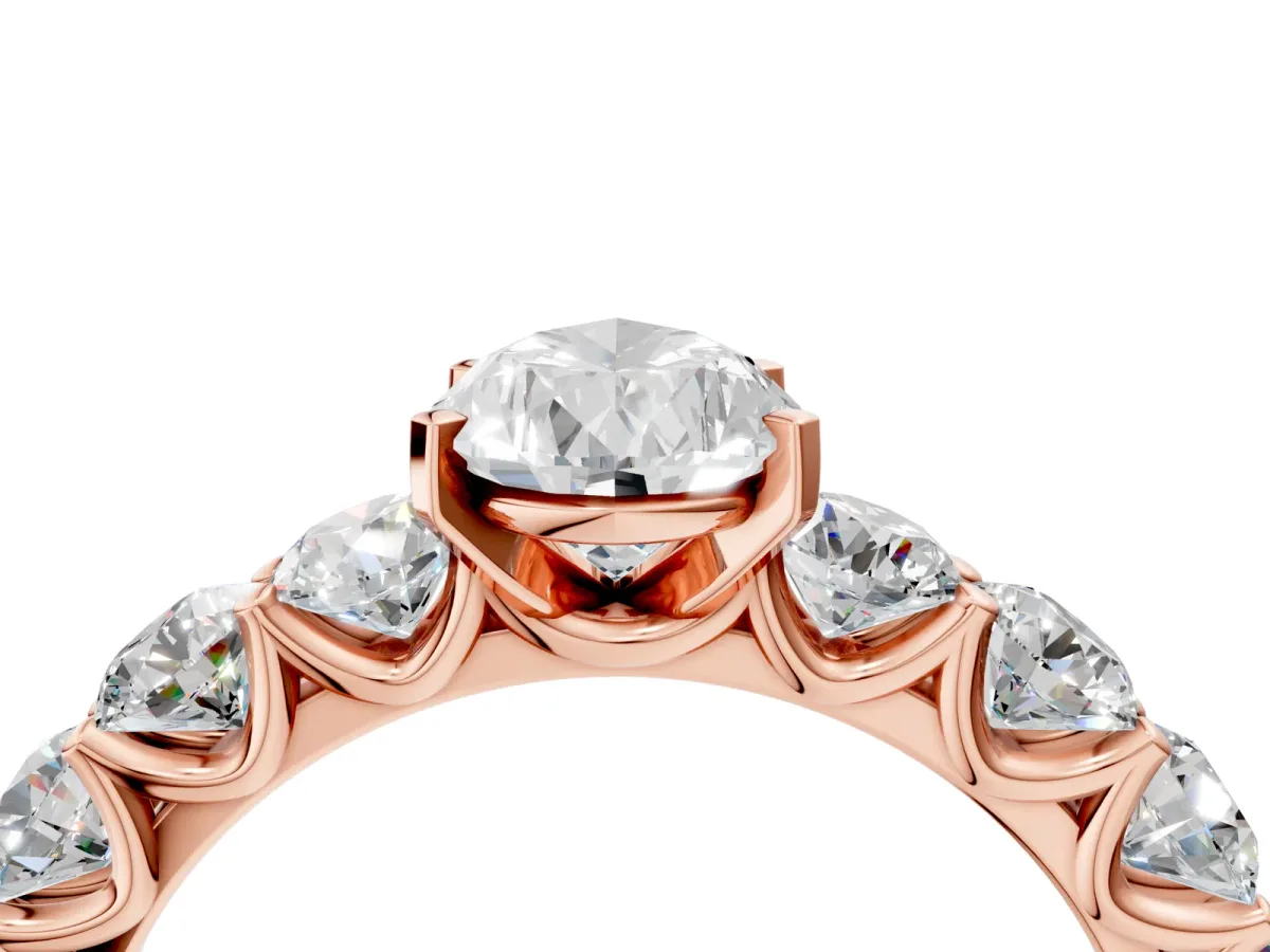 Pear Cut Diamond Prong Setting with Side Stones on a Pave Band Rose gold
