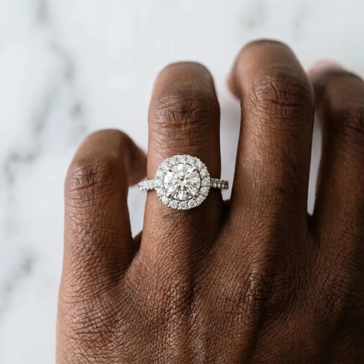 Round Cut Diamond Halo Ring with Pavé Band and Four-Prong Setting Silver