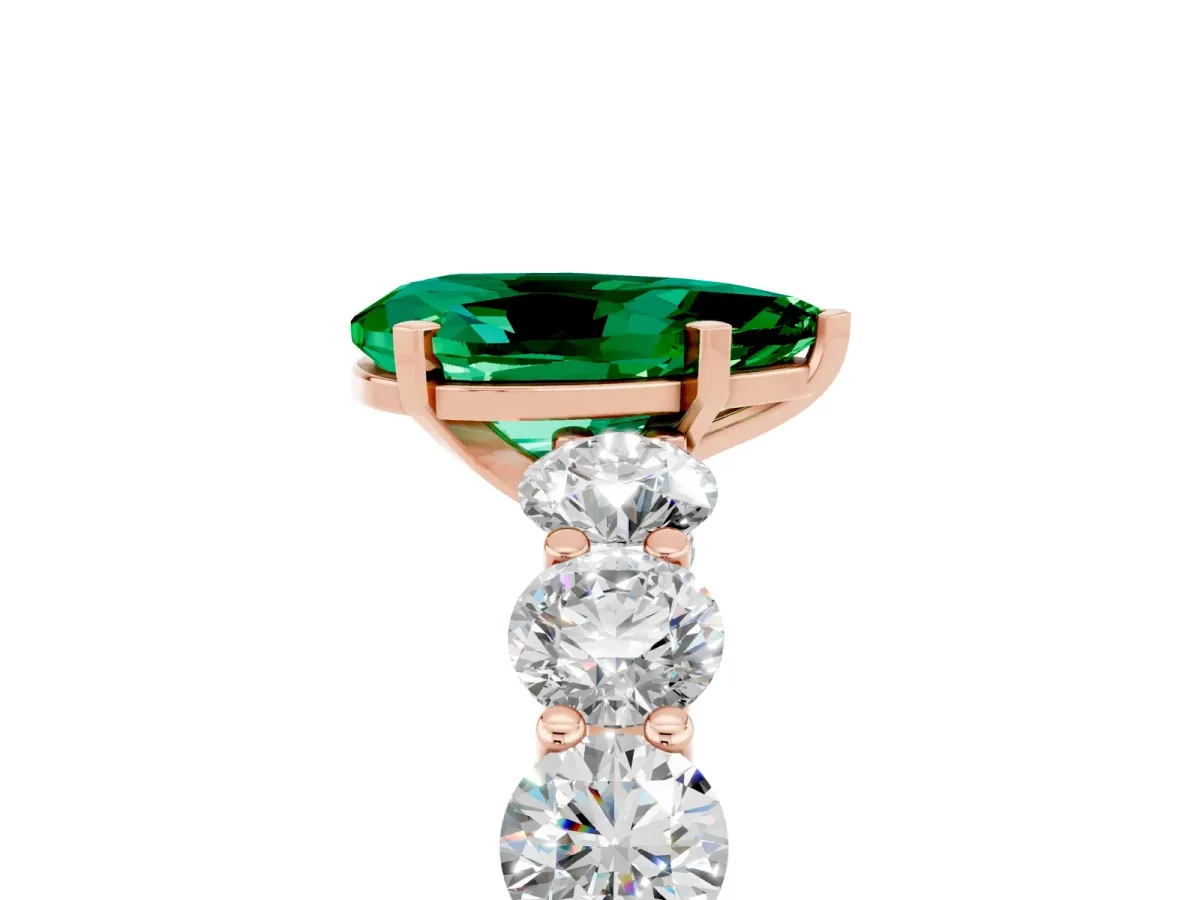 Pear Cut Emerald Prong Setting with Side Stones on a Pave Band Rose gold