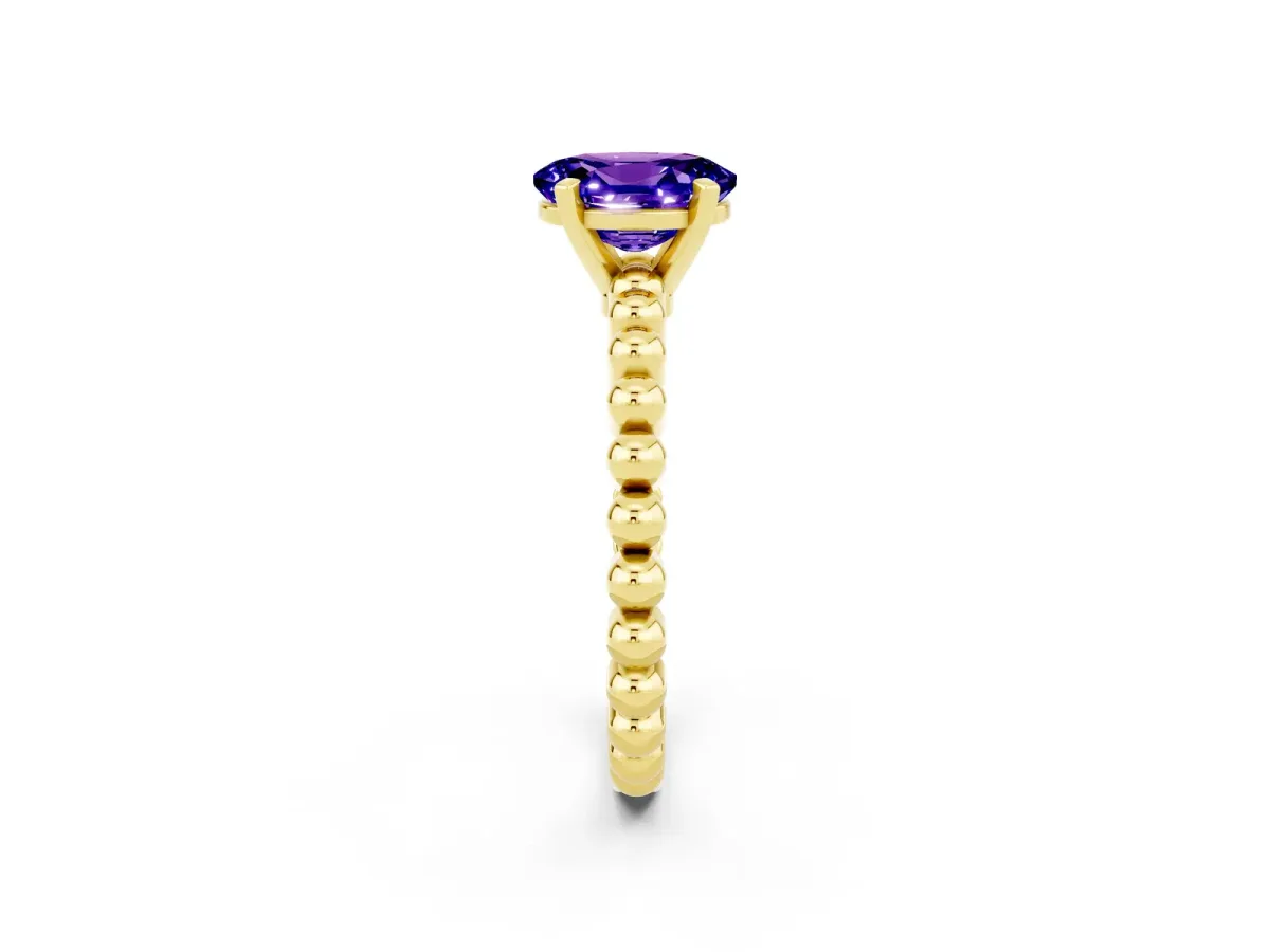 Oval Cut Tanzanite Solitaire Ring with Beaded Band and Prong Setting Yellow gold