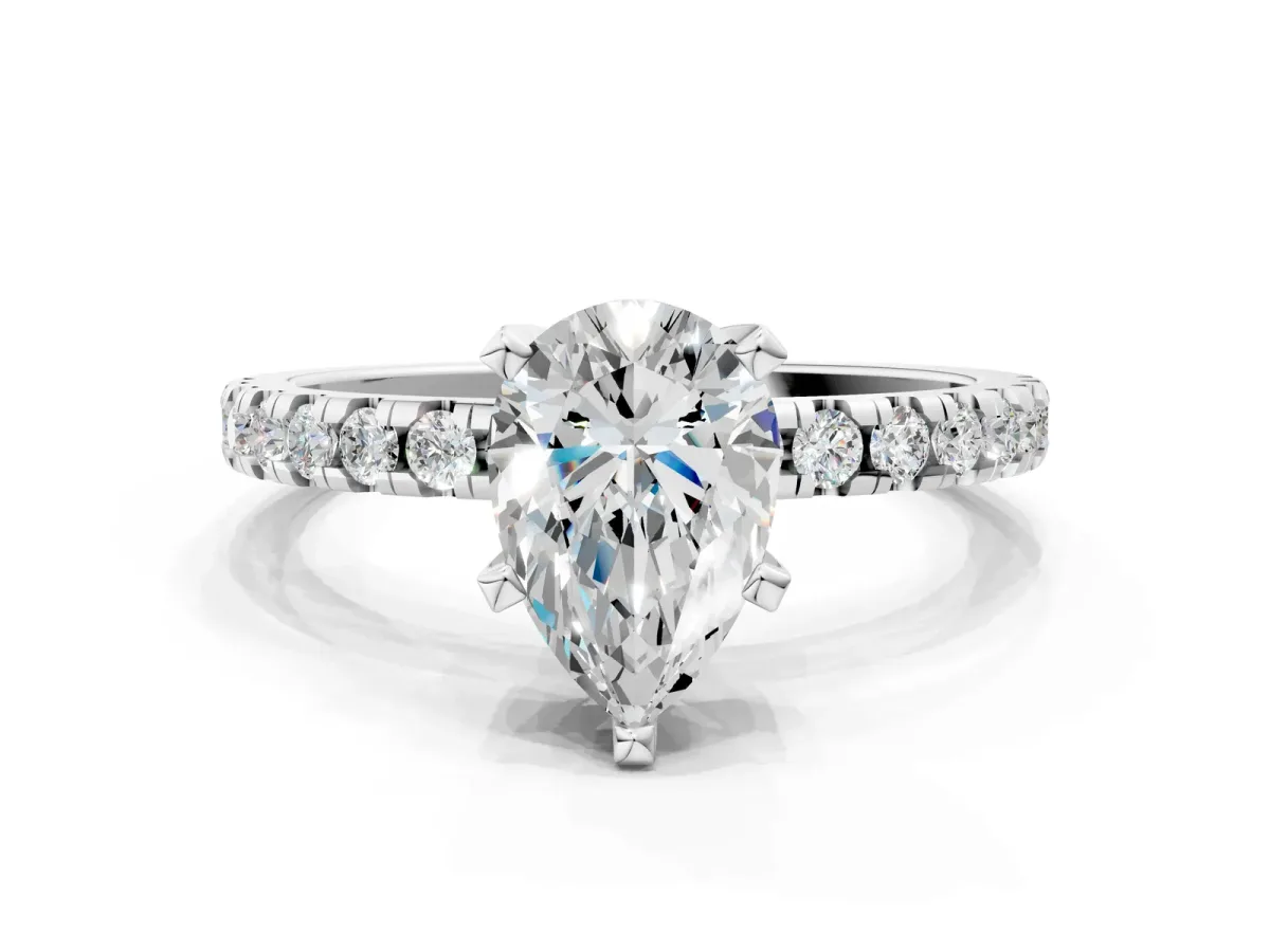 Pear Cut Diamond Solitaire Ring with Round Moissanite Pavé Band and Four-Prong Setting Silver