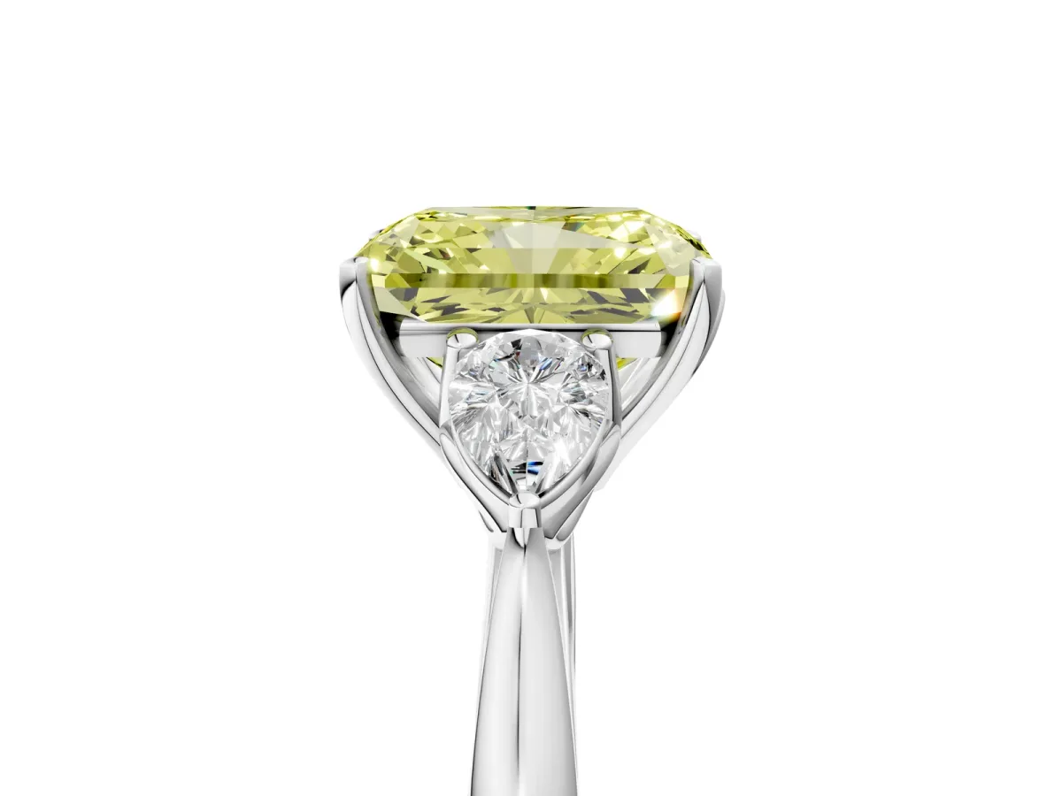 Fancy Yellow Three-Stone Radiant Cut Diamond Ring with Pear Side Stones in Four-Prong Setting Platinum