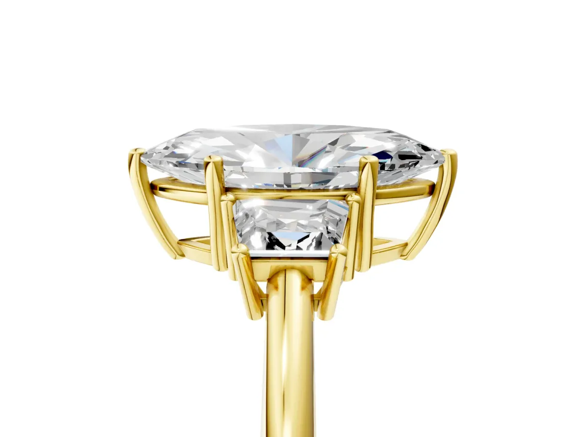 Marquise Cut Diamond Three-Stone Ring with Trapezoid Side Stones and Prong Setting Yellow gold
