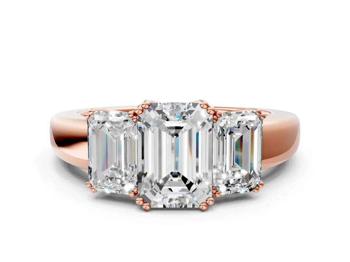 Three-Stone Emerald Cut Cut Diamond Ring with Channel Set Band and Four-Prong Setting Rose gold