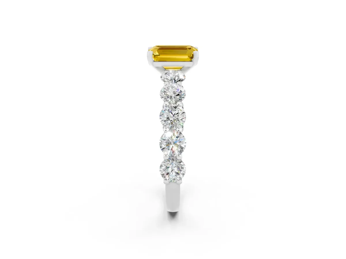 Emerald Cut Yellow Sapphire Prong Setting with Side Stones on a Pave Band Silver