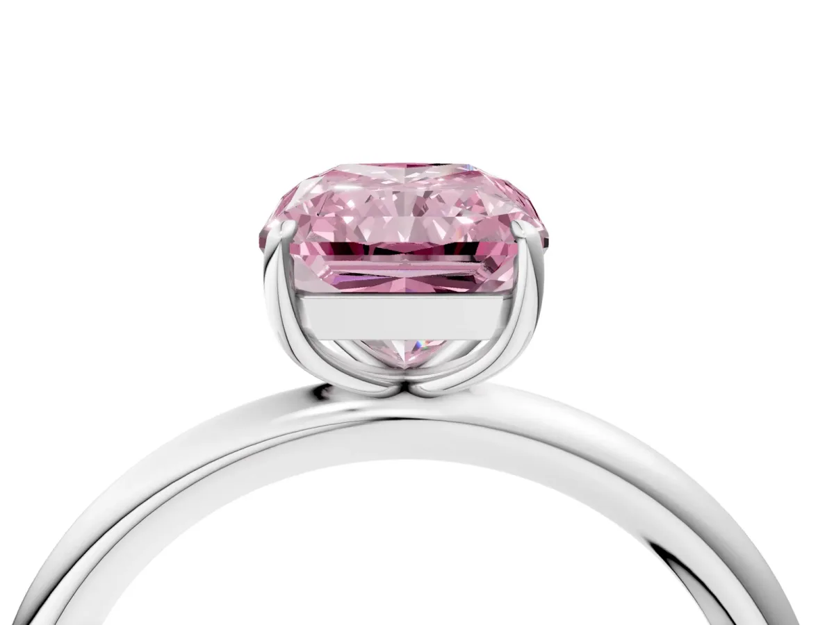 Fancy Pink Radiant Cut Solitaire Diamond Ring with Four-Prong Setting on a Plain Band Platinum