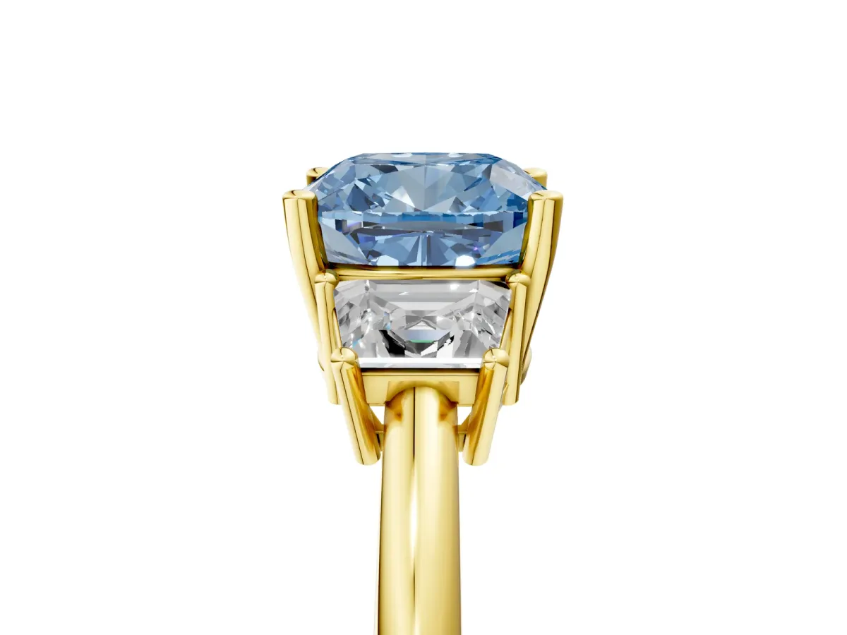 Fancy Blue Cushion Cut Diamond Three-Stone Ring with Trapezoid Side Stones and Prong Setting Yellow gold