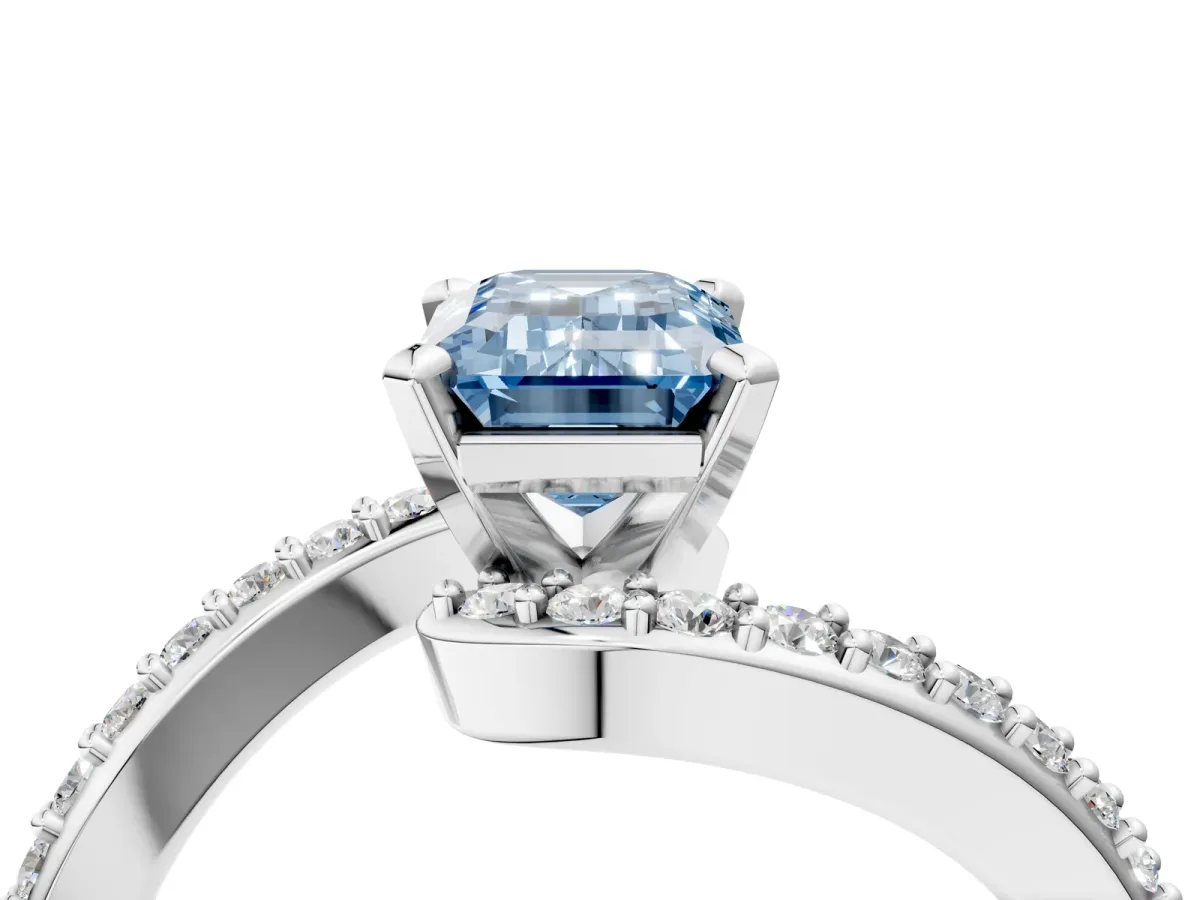 Fancy Blue Emerald Cut Solitaire Twist Band with Pave Set Diamonds and Four-Prong Setting Platinum