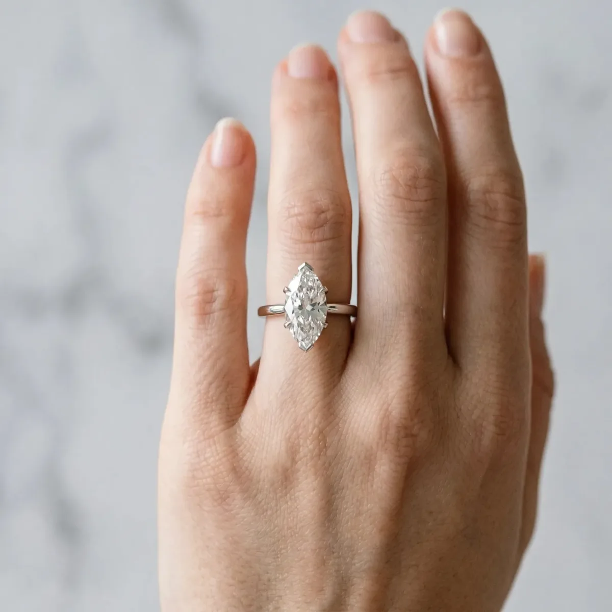Marquise Cut Diamond Solitaire Ring with Flower Prong Setting and Classic Band Silver