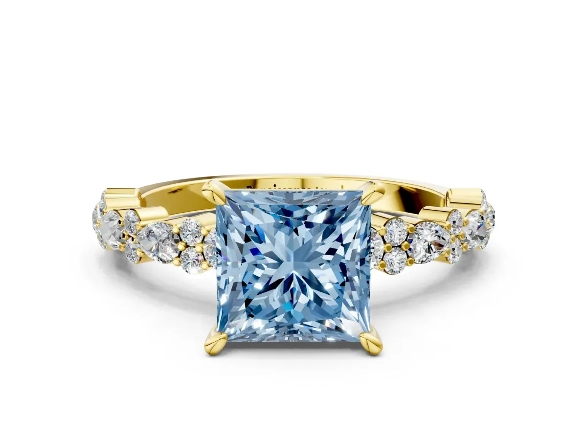 Fancy Blue Princess Cut Diamond Side Stone Solitaire Ring with Round and Four-Prong Setting Yellow gold