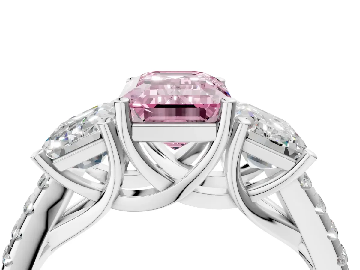 Fancy Pink Three-Stone Emerald Cut Diamond Ring with Round Pavé Band and Prong Setting Platinum