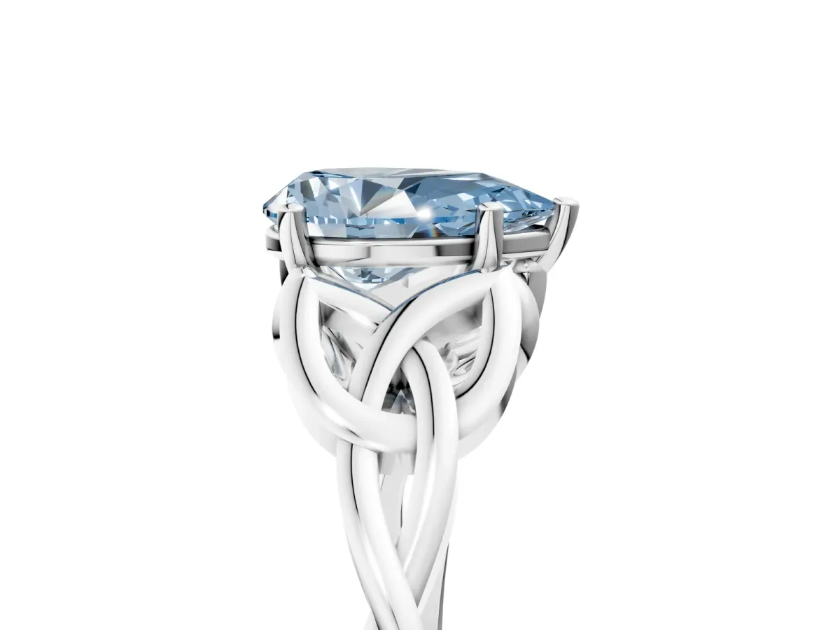 Fancy Blue Pear Cut Diamond Solitaire Engagement Ring with Celtic Knot Band and Four-Prong Setting Silver