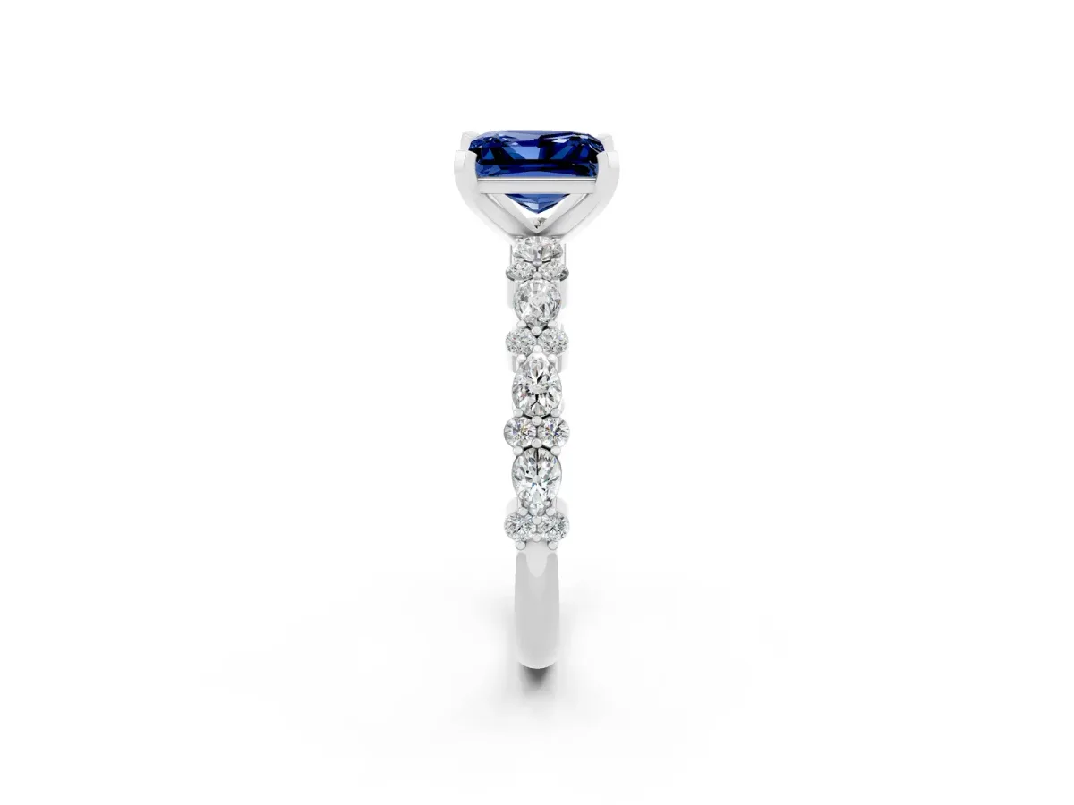 Princess Cut Blue Sapphire Side Stone Solitaire Ring with Round and Four-Prong Setting Platinum