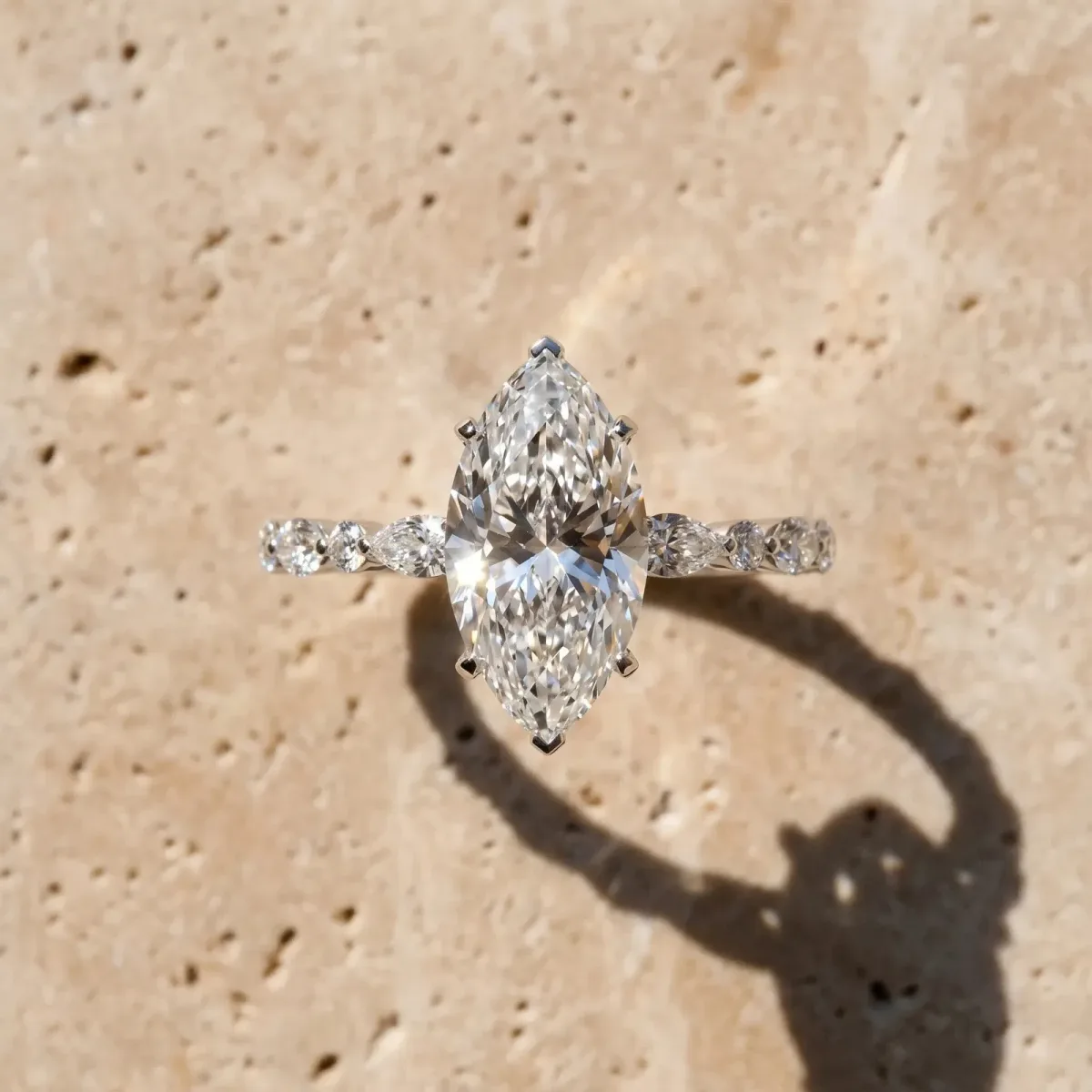 Marquise Cut Diamond Ring with Marquise and Round Side Stones and Four-Prong Setting Silver