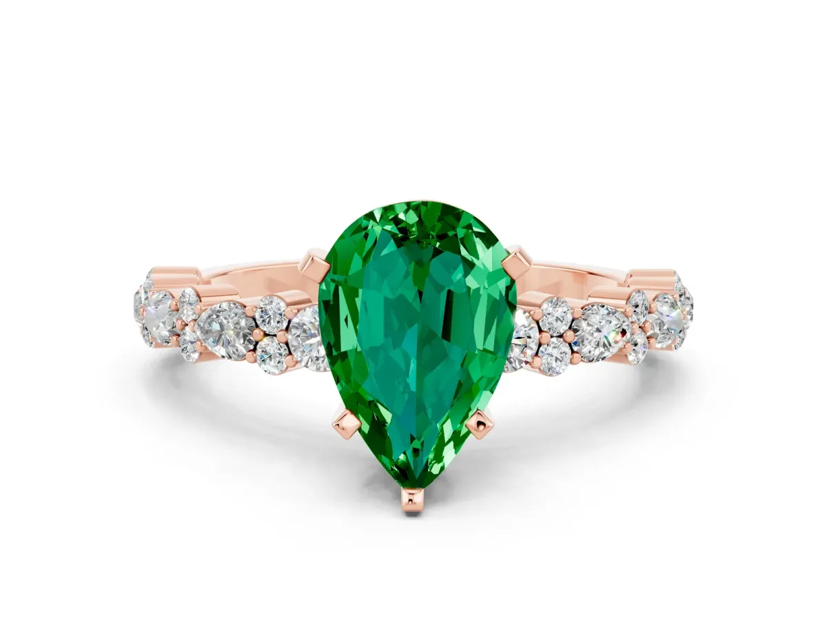 Pear Cut Emerald Side Stone Solitaire Ring with Round and Four-Prong Setting Rose gold