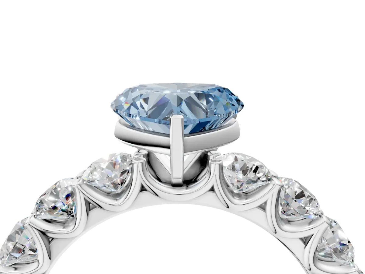 Fancy Blue Heart Cut Diamond Prong Setting with Side Stones on a Pave Band Silver