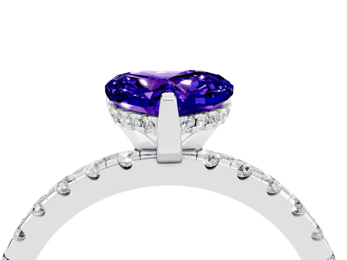 Heart Cut Tanzanite Solitaire Ring with Round Pavé Band and Four-Prong Setting Silver