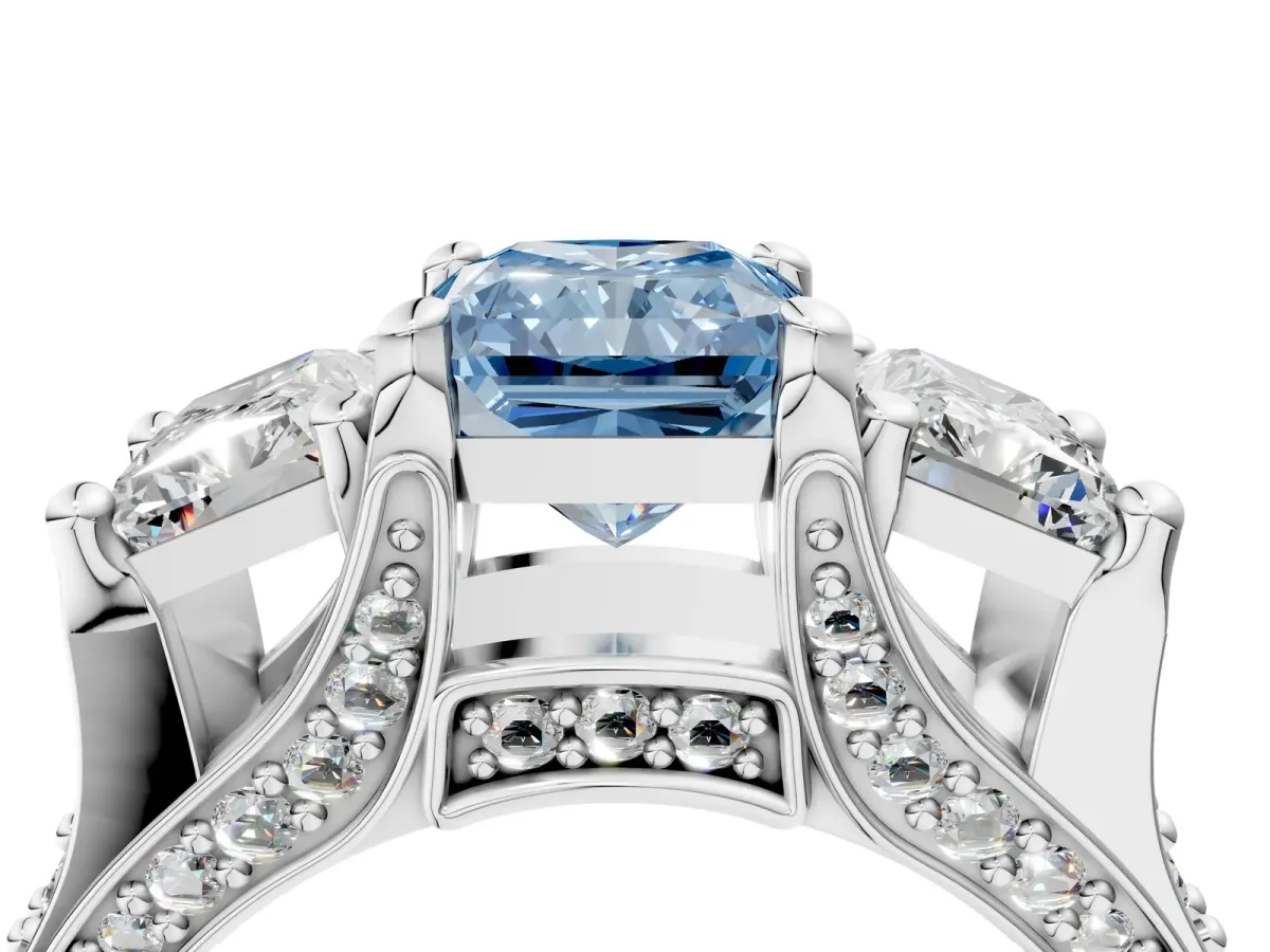 Fancy Blue Radiant Cut Diamond Three-Stone Ring with Channel Set Band and Four-Prong Setting Platinum