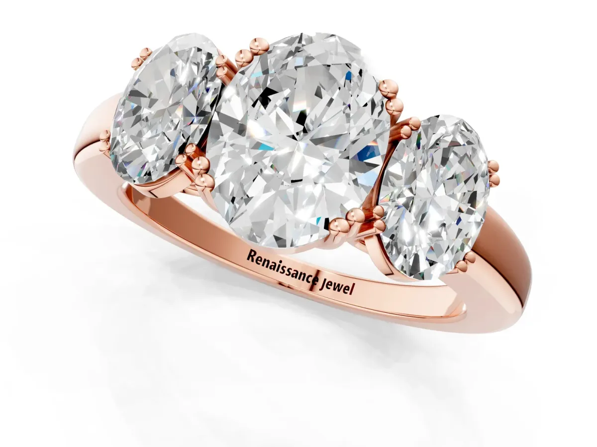Three-Stone Oval Cut Cut Diamond Ring with Channel Set Band and Four-Prong Setting Rose gold